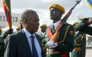 Zambian President Michael Sata inspects the guard of honor in Harare on April 25, 2012. Sata is on a on a two day state visit to Zimbabwe. AFP/PHOTO. Jekesai Njikizana. (Photo credit should read JEKESAI NJIKIZANA/AFP/Getty Images)