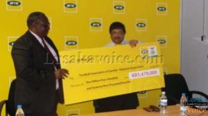 MTN Zambia chief executive officer Abdul Ismail handed over the cheque FAZ acting general secretary Sam Phiri in Lusaka