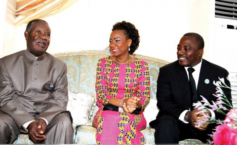 DEMOCRATIC Republic of Congo President Joseph Kabila (right) and his wife madam Marie Olive Lembe Kabila with President Sata at State House in Kinshasa wait for other visiting heads of state attending the Seventh COMESA Summit. - Picture by EDDIE MWANALEZA.