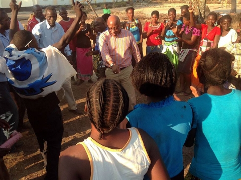 Dr Nevers Mumba dancing with supporters, Mangango