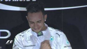 Lewis Hamilton strikes his chest on the podium as he reflects on what he has just achieved. The Briton, after six years of waiting, has another world title for his collection.