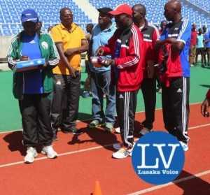 Ndola bases Referees instructor Bernarch Chabala in  a red track suit briefing FAZ Referee Committee Chairman Jeff Chipilingo  (in yellow golf T shirt)!  - Photo Credit Jean Mandela - Lusakavoice.com