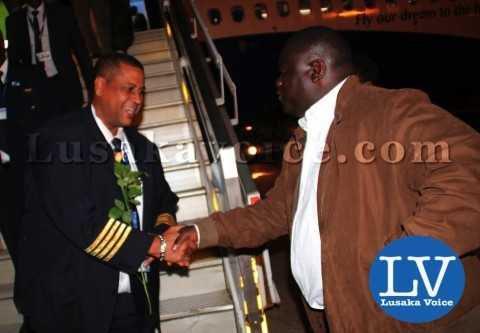 Minister of Transport and Communication Christopher Yaluma greeting the Rwandair Director of Flight Operations Santos Pio after landing   - Photo Credit Jean Mandela - Lusakavoice.com