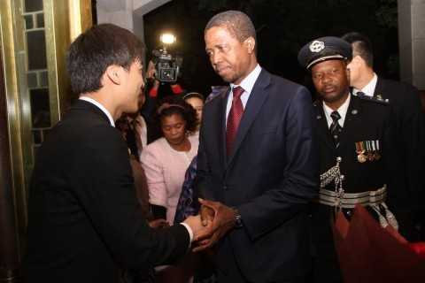 President Edgar Lungu greets Hong Qiao State Guest House's manager of building number two Ivan Lu on arrival at the State Guest House in Shanghai, China on March 26,2015 -Pictures by THOMAS NSAMA