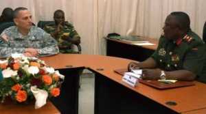 U.S. Army Africa Deputy Commanding General, Brig. Gen. Peter L. Corey engages with Lt. Gen. Paul Mihova, commander of the Zambian Army during a meeting at the Zambian Ministry of Defense. 