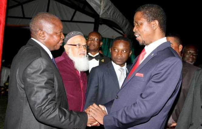 President Edgar Chagwa Lungu with Former Bank of Zambia Governor Caleb Fundanga at Zambia's Ambassador to Zimbabwe's residence in Harare where he addressed Zambia's leaving in Zimbabwe on April 29,2015 -Picture by THOMAS NSAMA