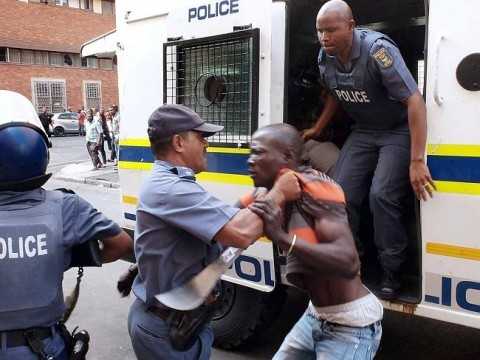 Stand-off continues ... South African Police try to control a protester. Picture: AFP Photo Source: AFP