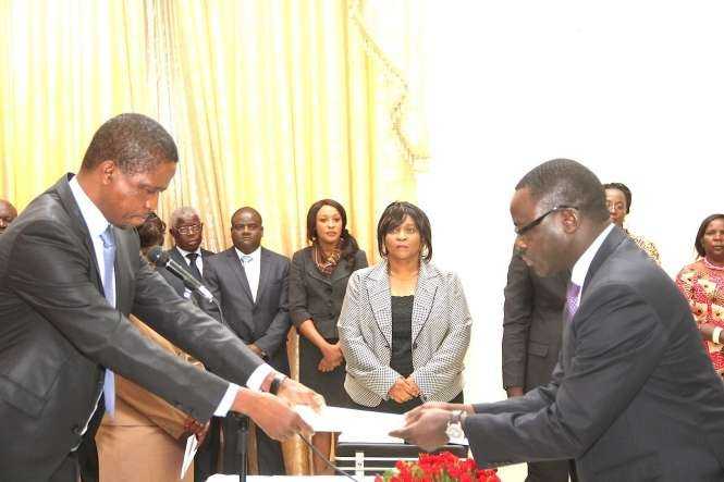 President Edgar Lungu receives an affidavit of Oath from Zambia's Ambassador to France Humphrey Chibanda during the swearing -In-Ceremony at State House on May 4,2015 -Picture by THOMAS NSAMA