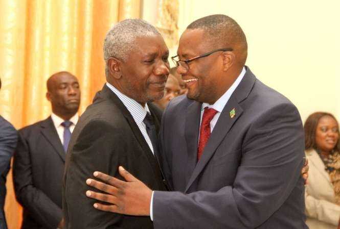 Zambia's High Commissioner to South Africa Emmanuel Mwamba (r) being congratulated by State House Senior Private Secretary Ogeon Gondwe during the swearing -In-Ceremony at State House on May 4,2015 -Picture by THOMAS NSAMA