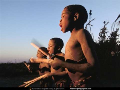 Newly circumcised boys greet dawn with traditional song and drumming in Lukulu, Zambia.