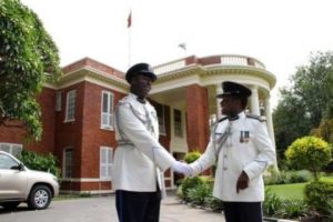 Dr Solomon Jere congratulates Lemmy Kajoba after his appointment and swearing in at State House as Police Commissioner for Muchinga Province