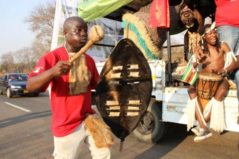 Lovemore Moyo member of the Horn of Africa group perform during a street carnival in Victoria Falls