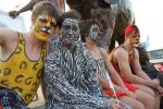 Participants of the Victoria falls street carnival pose for a picture in Chimotimba stadium