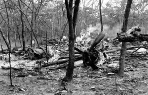 In this Sept. 19, 1961 file photo, searchers walk through the scattered wreckage of the DC6B plane carrying Dag Hammarskjold in a forest near Ndola, Zambia. America’s National Security Agency may hold crucial evidence about one of the greatest unsolved mysteries of the Cold War _ the cause of the 1961 plane crash which killed United Nations Secretary-General Dag Hammarskjold, a commission which reviewed the case said Monday, Sept. 9, 2013. Widely considered the U.N.’s most effective chief, Hammarskjold died as he was attempting to bring peace to the newly independent Congo. The crash of his DC-6 aircraft in the forest near Ndola Airport in modern-day Zambia has bred a rash of conspiracy theories, many centering on some startling inconsistencies. (AP Photo)
