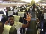 Skipper Chris Katongo gives a wave of confidence as the Chipolopolo settle into their charter aircraft for the flight to Kumasi.