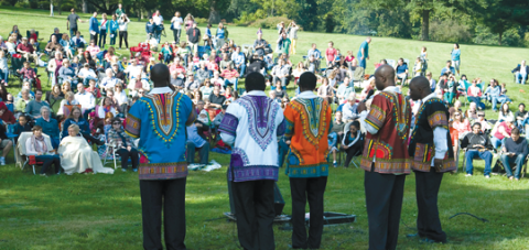 A choir from Zambia leads worship as Mennonites from Lancaster, Pa., city churches meet in Lancaster County Central Park for worship and a carry-in lunch