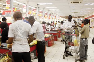 SHOPRITE workers have called off their strike waiting for fresh negotiation to be concluded within 10 days .Here workers at Manda Hill outlet going on with their work. –Picture by COLLINS PHIRI