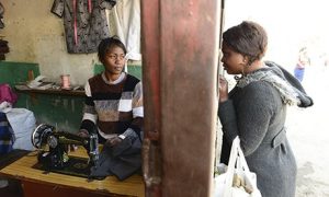 Alice Kalumbu (left) in her tailoring shop in Lusaka. Photograph: Francois d'Elbee 