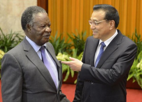 In this Saturday April 13, 2013 file photo Chinese Premier Li Keqiang, right, talks with Zambia's President Michael Sata