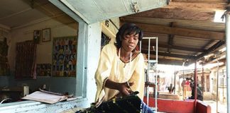Isabel Kachinda at her tailoring shop in Bwafwano market, which she has built up thanks to business