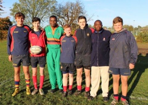 Zambian visitors Joseph Ingwe (left) and Caution Bweupe (right) with members of the Wisbech Grammar School 1st XV