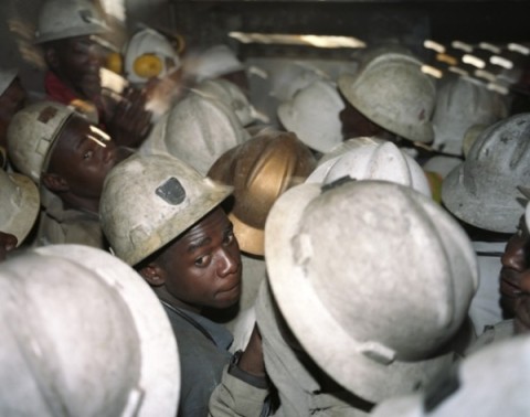 30 employees of Mopani Copper Mines (MCM) are crowded in the elevator, which will bring 1.5 km below the earth to work in the film SOB copper mine. The Swiss commodities company Glencore's Mopani Copper Mines majority shareholder of and employs approximately 20,000 Zambians.