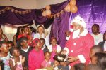 Deputy Minister of Commerce and Industry and Matero member of Parliament Miles Sampa briefly turned Santa Claus and shared gifts with children and some senior residents at Matero Stadium in Lusaka. – Picture by CHANDA MWENYA