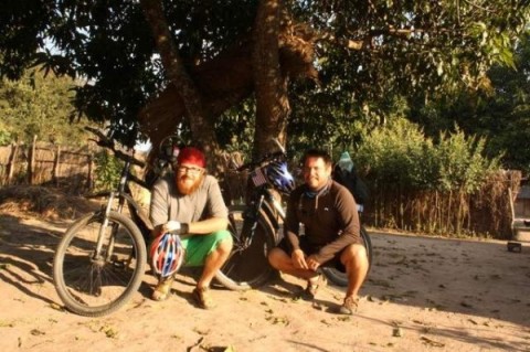 Jordan Blekking, right, poses with his friend and Peace Corps colleague, Ryan Brink, before a bike trip this summer. Brink left Zambia and returned to the United States in September