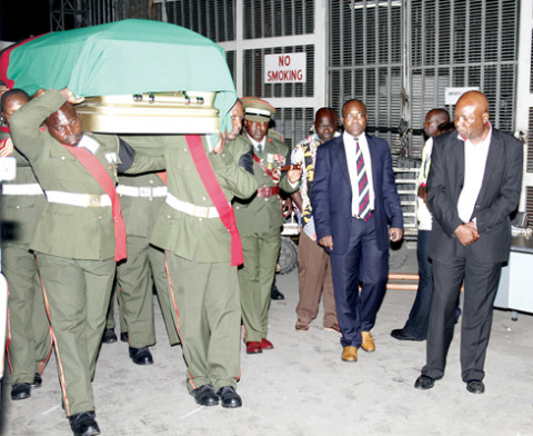 PALL-BEARERS carry the remains of late deputy minister of Health Dr Patrick Chikusu at Kenneth Kaunda International Airport on Thursday night