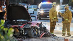 Sheriff’s deputies work near the wreckage of a Porsche that crashed into a light pole on Hercules Street near Kelly Johnson Parkway in Valencia, Calif., on Saturday, Nov. 30, 2013. A publicist for actor Paul Walker says the star of the “Fast & Furious” movie series died in the crash north of Los Angeles. AP 