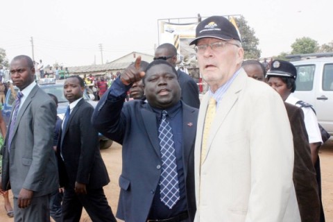 Vice-President Dr Guy Scott listens to Works, Supply, Transport and Communications minister Yamfwa Mukanga during the launch of Pave Zambia 2000 by President Sata in Lusaka's Chawama Township on September 18,2013