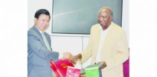 FINANCE and National Planning Minister Alexander Chikwanda and Chinese Ambassador to Zambia Yuxiao Zhou exchange documents after signing the agreements on a grant and interest free loan given to the Zambian Government by China yesterday in Lusaka. Picture by CLEVER ZULU