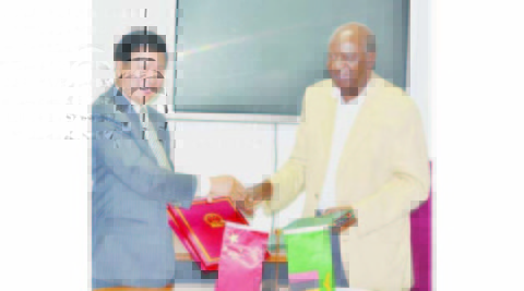 FINANCE and National Planning Minister Alexander Chikwanda and Chinese Ambassador to Zambia Yuxiao Zhou exchange documents after signing the agreements on a grant and interest free loan given to the Zambian Government by China yesterday in Lusaka. Picture by CLEVER ZULU FINANCE and National Planning Minister Alexander Chikwanda and Chinese Ambassador to Zambia Yuxiao Zhou exchange documents after signing the agreements on a grant and interest free loan given to the Zambian Government by China yesterday in Lusaka. Picture by CLEVER ZULU