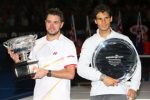 Stanislas Wawrinka of Switzerland poses with Norman Brookes Challenge Cup after defeating Rafael Nadal