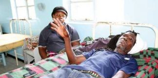 43-YEAR-OLD Mazabuka accident survivor Joseph Nsamba explaining his ordeal at Mazabuka District Hospital on Friday, looking on is his wife Phoebe. - Picture by ANGELA MWENDA.