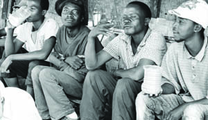  A group of men enjoys a local brew during the early hours of a working day.