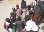 JOANNE BOLLINGER, of Brunswick and resident of Thornton Oaks retirement community, reads to children from the Sishekanu Basic School on her trip last June to Zambia. CONTRIBUTED PHOTO
