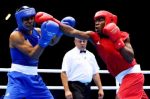 Jeffrey Horn of Australia (L) in action with Gilbert Choombe of Zambia during their Men's Light Welter (64kg) Boxing bout