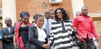 MINISTER of Tourism and Arts Sylvia Masebo (middle) after appearing before the tribunal at Supreme Court in Lusaka yesterday. – Picture by COLLINS PHIRI.