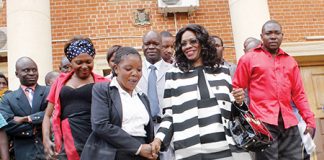 MINISTER of Tourism and Arts Sylvia Masebo (middle) after appearing before the tribunal at Supreme Court in Lusaka yesterday. – Picture by COLLINS PHIRI.