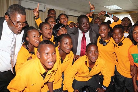 MINISTER of Youth and Sport Chishimba Kambwili (middle) and his deputy Christopher Mulenga (left) with under-17 women’s national team players at Lusaka’s Kenneth Kaunda International Airport yesterday. – Picture by JEAN MANDELA.