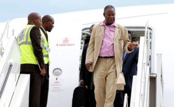 President Michael Sata alights from Emirates plane at Kenneth Kaunda International Airport from London -Pictures by EDDIE MWANALEZA