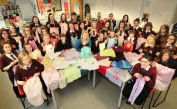 Students and teacher Stephanie Fraser at Cromwell Community College with the dresses made from pillow cases to send to Africa, for the children at Chisokone school.