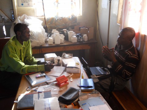 Data Collection Officer Mambwe Ng'oma interviews an Environmental Health Technologist (EHT) at Bushinga Rural Health Center, Itezhi-Tezhi, Zambia