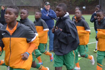 Geoffrey Levy watches the Zambia womens u-17 national soccer team warm up at practice on Monday, Mar. 3, 2014, in San Rafael, Calif. He is helping the girls, age 14-17, achieve a spot in the World Cup games. (Frankie Frost/Marin Independent Journal) Frankie Frost