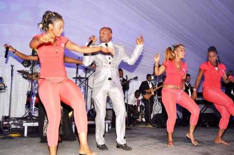 Koffi Olomide and dancing queens during the wedding ceremony of Bona Mugabe, Daughter to Robert Mugabe , President of the Republic of Zimbabwe and Simba