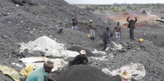 Youths scavenging the remains of the metals in the abandoned ZCCM black mountain in Kitwe - picture Thepost