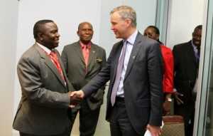 Minister of foreign affairs Mr Harry Kalaba greets British Parliamentary Under Secretary of State Mr Mark Simmonds shortly before their meeting in Brussels, Belgium on Thursday, 03-04-2014. Picture by EDDIE MWANALEZA