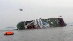 South Korean rescue helicopters fly over a South Korean passenger ship, trying to rescue passengers from the ship in water off the southern coast in South Korea, Wednesday, April 16, 2014