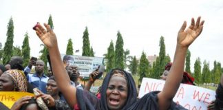 A mother cries out during a demonstration with others who have daughters among the kidnapped